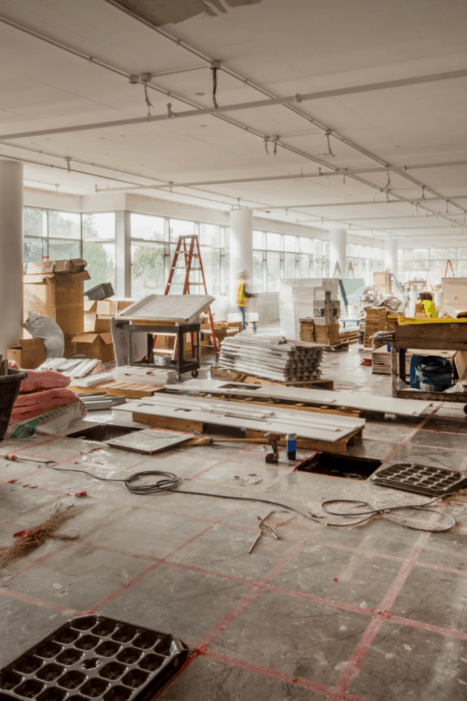Workers finalizing sterile workspaces for dental instrument preparation